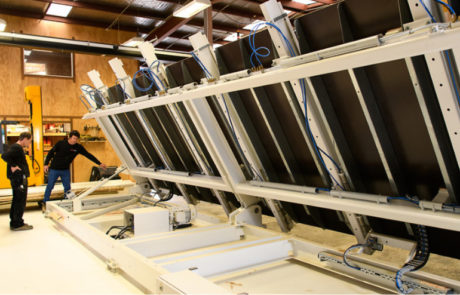 Frank House's hydraulic table being operated by Duane and Ingo creating prefab panels